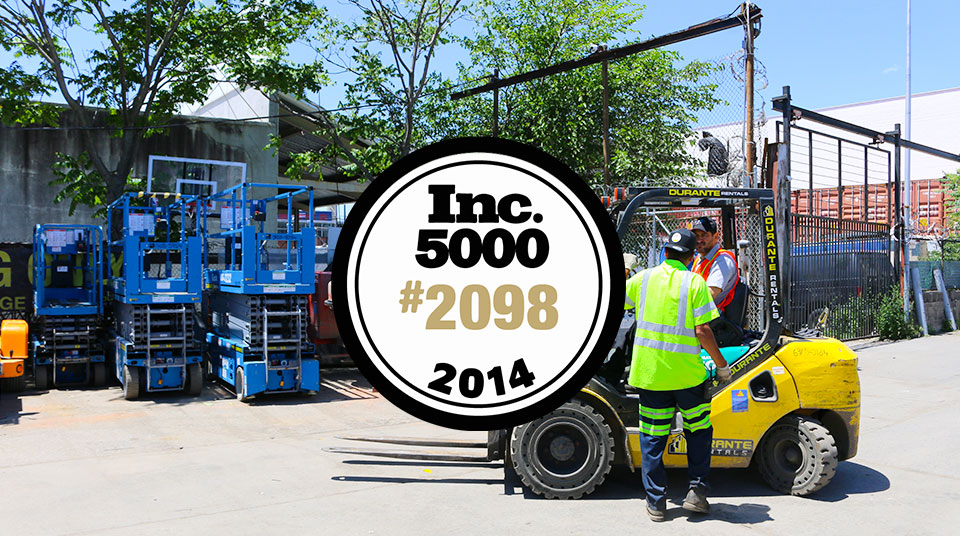 Forklift in yard with 2014 INC 5000 badge #2098
