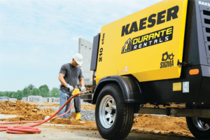 Man uses Kaeser Compressor to power rock drill