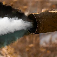 Three colors of smoke pouring out of exhaust pipe