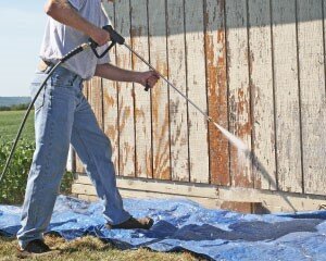 hot pressure washer removing barn paint